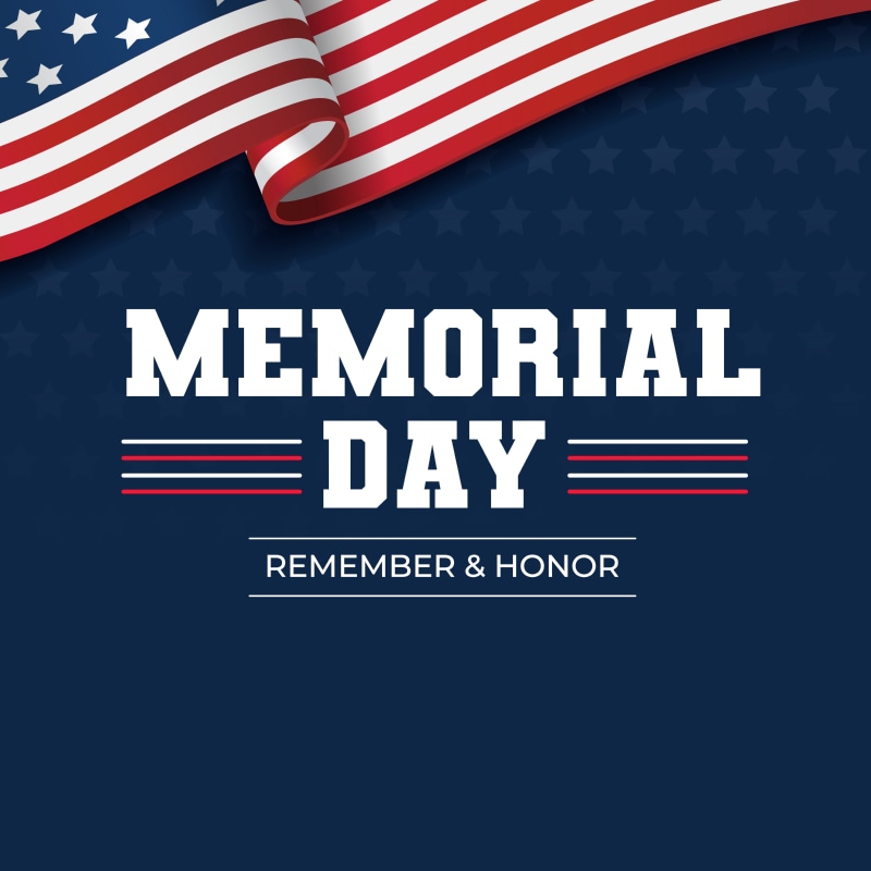Patriotic Memorial Day graphic with a wavy American flag along the top edge, white bold text reading Memorial Day, and the words Remember & Honor on a dark blue background with star patterns.