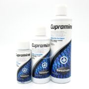 Three SEACHEM CUPRAMINE bottles are showcased, each white with blue labels featuring a scale pattern and a medical cross symbol. They vary in size from smallest to largest, highlighting the trusted efficacy of the product.