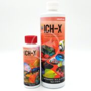 Two bottles of HIKARI ICH-X fish treatment for aquariums are displayed, featuring vibrant orange labels with images of colorful fish. The smaller bottle is 4 fl. oz., and the larger one is 16 fl. oz., both expertly formulated to treat fish diseases.