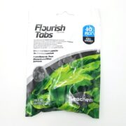 A package of SEACHEM FLOURISH 40 TABS for aquariums is shown, featuring white packaging with green plant graphics. It highlights gravel bed supplements enriched with micro elements and nutrients.