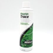 The 500 ml white bottle of SEACHEM FLOURISH TRACE for planted aquariums features a label with green aquatic plants, emphasizing essential trace elements to enhance your aquariums vitality and color.