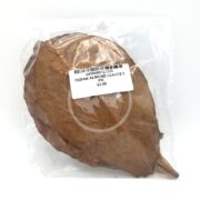 A clear plastic bag contains three preserved Indian almond leaves with a white label showcasing a barcode and the product name: INDIAN ALMOND LEAVES 3 PK for $3.99, inviting curiosity about their natural elegance.