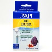 The API KH TEST KIT measures carbonate hardness in aquarium water, promoting a healthy environment for tropical fish. The blue and white packaging displays images of colorful fish and includes benefits in English and French.