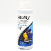The SEACHEM VITALITY white bottle holds 100 mL (3.4 fl oz) of vitamin and amino acid supplement for marine fish, enriched with Vitamin C. It features a colorful fish image and a blue design.