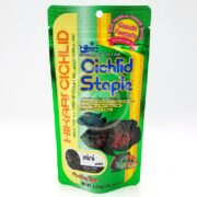 A vibrant package of HIKARI CICHLID STAPLE MINI FLOAT 2.01 OZ (57G) features a fish image, bold branding, and notes Growth Formula and Floating Type.