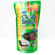 The HIKARI CICHLID STAPLE LARGE FLOAT 8.8 oz (250g) package is green and red, features a fish, and highlights its Growth Formula to reduce color fading.
