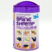 The HIKARI FREEZE DRIED BRINE SHRIMP .42 OZ features a purple lid, images of fish, and boasts bio-encapsulated multi-vitamins ideal for all tropical and marine fish.