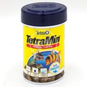 The TETRAMIN TROPICAL TABLETS 1.69 OZ (48G) come in a yellow container with a black lid and fish images. This easily digestible, complete diet helps your aquatic pets thrive.