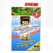 The EHEIM EVERYDAY FISH FEEDER packaging features a digital timer at 9:30, promoting easy feeding for healthier fish. Colorful images of fish and aquariums highlight its benefits, with bold colors and text highlighting features and a 3-year guarantee.