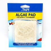 The API ALGAE PAD FOR ACRYLIC features blue and yellow packaging with illustrations of small fish and bubbles, housing a light-colored pad in the center.