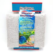 The SEAPORA PAD NITRATE/NITRITE 10X18 package features blue, red, and white text with colorful fish illustrations at the bottom, emphasizing its aquatic use. The clear front reveals a gray textured pad inside, ensuring effective filtration.