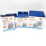 Four AQUEON FILTER CARTRIDGE packages in different sizes, marked with a large L on blue and white packaging featuring fish images, are neatly arranged.