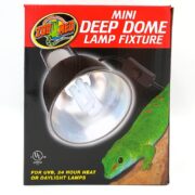 The ZOO MED DEEP DOME LAMP MINI 5.5 box features a lamp image with a green lizard on a branch. It emphasizes UL listing and suitability for UVB, 24-hour heat, or daylight lamps.