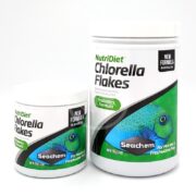 Two SEACHEM NUTRIDIET CHLORELLA FLAKES containers for marine and freshwater fish, one larger than the other, feature vibrant fish images and highlight their Probiotics Formula with No Artificial Dyes.