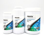 Three SEACHEM MATRIX water treatment containers in various sizes are displayed, each with a white exterior and the unique blue and green label featuring bubble imagery that highlights the brand name.