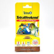 The vibrant yellow packaging of TETRA TETRAWEEKEND showcases colorful fish and features the text: Feeds Up to 5 Days, 2 Feeding Blocks, Quality Nutrition, Net Wt. 0.85 OZ (24 g). This plaster-free solution ensures peace of mind for your aquatic friends.