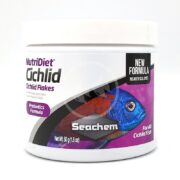 The SEACHEM NUTRIDIET CICHLID FLAKES container, adorned with a vibrant fish, highlights its probiotics-packed new formula and absence of artificial dyes. Designed for all cichlid fish, it weighs 50g (1.8 oz).