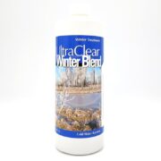 A white bottle of ULTRACLEAR WINTER BLEND is set against a plain background. Its label depicts snow-covered trees in a winter wonderland and reads Winter Treatment and Cold Water Bacteria.
