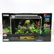 The image displays the packaging for the FLUVAL SPEC V 5 GAL AQUARIUM KIT BLACK, featuring a compact aquarium with aquatic plants and fish. Key features highlighted are bright 7000K LED lighting and a sizable 5-gallon capacity.