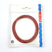 The EHEIM 7287148 SEALING O-RING 2217 is red and attached to a white card with a hang tab, featuring blue wave lines and a recycling symbol in the bottom left to highlight sustainability.