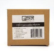 A brown box labeled SR Aquaristik CO2 Regulator Expansion Module shows a logo and website, listing features like a bubble counter, needle valve, compatibility with single and dual-stage regulators, plus easy installation.