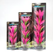 Three packaged artificial aquarium plants with pink and green leaves are shown on a white background. Their packaging, featuring text and nature imagery, captures the elegance of the UT PINK SABER SWORD slicing through serene aquatic landscapes.