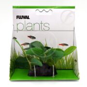 The FLUVAL SAMOLUS SWORD PP1622 aquarium set features vibrant green artificial plants, resembling samolus or sword varieties, secured to a black base. The packaging boasts charming illustrations of colorful fish swimming together.
