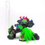 The PP RESIN CORAL REEF ARCH GREEN RR3151 by Penn Plax features a coral reef design with purple coral-like structures and vibrant green, pink, and blue plants, shown with a ruler for scale against a plain white background.