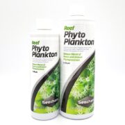 Two SEACHEM REEF PHYTOPLANKTON bottles, one 250 ml and one 500 ml, have green and white labels with phytoplankton images. The labels describe a rich blend of green and brown phytoplankton for aquariums.