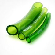 Four diagonally arranged green transparent EHEIM TUBING PER FT hoses of different diameters lie on a white background, each displaying white text for size and brand.