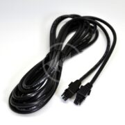 A coiled black NEPTUNE 1 LINK MALE MALE EXTENSION CABLE 10 FT (CBL-1LINK-MM-10) with male-male connectors and multiple pins is laid on a plain white surface, neatly arranged with some text imprinted along its length.