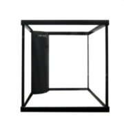 An open black cube structure on a white background, similar to the SEAPORA REEF READY AQUARIUM, is adorned with a cylindrical black object affixed to one corner.