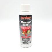 The KORDON METHYLENE BLUE 4 OZ (118 ML) treatment comes in a white bottle with fish images on the label and is designed to prevent general diseases in both freshwater and saltwater aquariums.