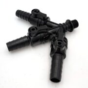 Black plastic three-way hose connector with barbed ends and shut-off valves, designed for splitting or controlling water flow in irrigation or other fluid systems, placed on a white background.
