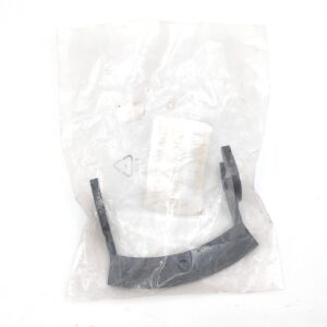 A black, curved plastic or metal part is sealed in a transparent plastic bag with a white label inside, all placed on a white background.