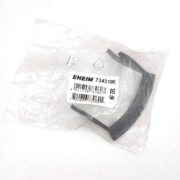 A black plastic part in a clear plastic bag labeled EHEIM 7343100 with a barcode and recycling symbol on the sticker, placed on a white background.