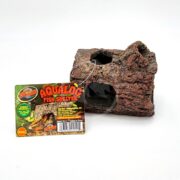 The ZOO MED AQUA LOG RESIN SINKING is a fish shelter shaped like a log with inviting openings for your aquarium. Its brown hue and rough texture add authenticity, while the colorful label proudly displays the brand and product details.