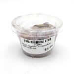 A clear plastic container with a lid holds a plant bulb. A white label on the lid reads 21884 BULB - DWARF LILY Nymphaea stellata / BULB, and the price is $5.99.
