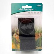 A packaged black inlet sponge labeled Inlet Sponge - L by Dista, displayed against a green background with an image of a lizard and grass. The sponge is visible through clear plastic packaging.