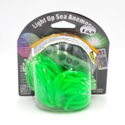 Packaging of a Light Up Sea Anemone toy with multicolored LED lights. The toy is bright green, tentacle-shaped, and includes a remote control visible through the clear plastic packaging.
