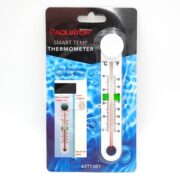 A packaged Aquatop Smart Temp Thermometer with a white body and a clear tube, shown against a blue water-themed background. The package highlights its unique magnetic mounting system and aquarium use.