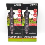 Two boxes of Aquael Flow Heater Professional aquarium heaters (models 300 and 500) with product images, features, and temperature ranges displayed on the front of the packaging.