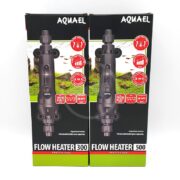 Two boxes of Aquael Flow Heater Professional aquarium heaters (models 300 and 500) with product images, features, and temperature ranges displayed on the front of the packaging.