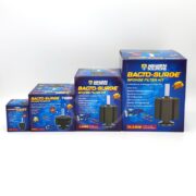 Four boxes of the AQUARIUM SOLUTIONS BACTO-SURGE SPONGE FILTER kit, from mini to X-Large, are neatly lined up. Each blue box displays vibrant tropical fish images alongside a sponge filter.