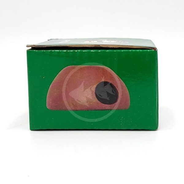 A green rectangular box with an illustration of a brown dome-shaped object and a black circle on its front side, set against a plain white background.