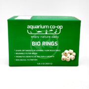Green box labeled Aquarium Co-Op Bio Rings. Text highlights features such as reusable filter media, shape for minimal flow resistance, and promotion of beneficial bacteria. Small image shows white cylindrical rings.