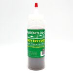 A clear squeeze bottle with a red-tipped nozzle, labeled Aquarium Co-Op Easy Fry Food. The bottle contains fish food for fry, with green and yellow text and images of fish on the label.