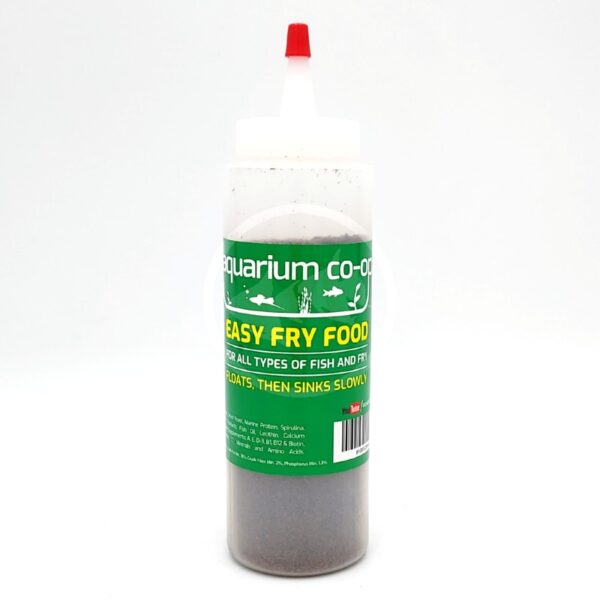 A clear squeeze bottle with a red-tipped nozzle, labeled Aquarium Co-Op Easy Fry Food. The bottle contains fish food for fry, with green and yellow text and images of fish on the label.
