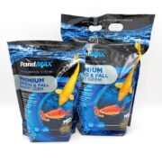 Two bags of PondMAX Premium Spring & Fall Wheat Germ fish food, featuring images of koi fish and water design on the packaging. The bags are blue with orange and white koi graphics and product information on the front.