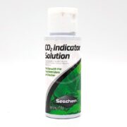 A small white bottle labeled CO2 Indicator Solution by Seachem, featuring green leaves on the label and designed for use with Seachem glass pH checkers. The bottle contains 50 mL (1.7 fl oz) of solution.